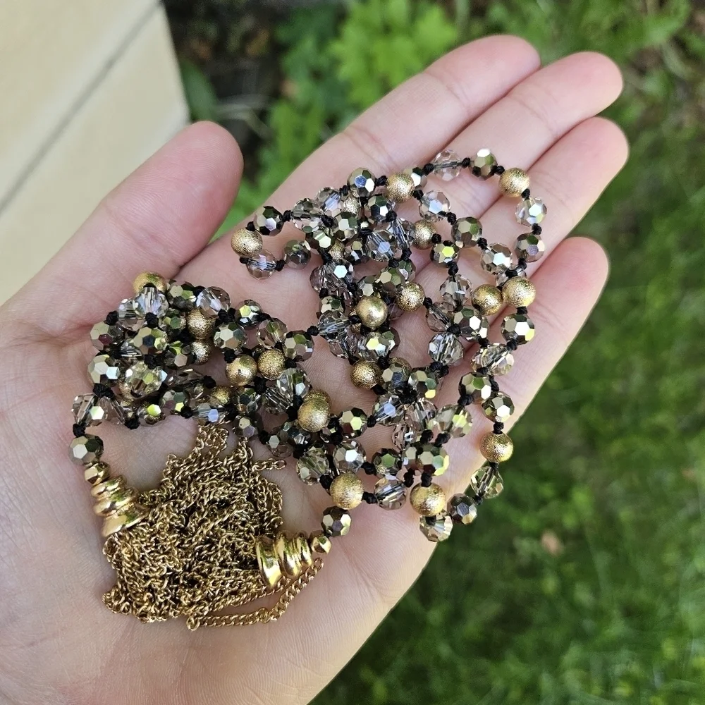gold tone and gray crystal beaded necklace with gold chain tassel